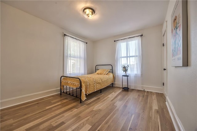 2606 Smart Ave, Kansas City, MO 64124 - bedroom with wood finished floors and baseboards
