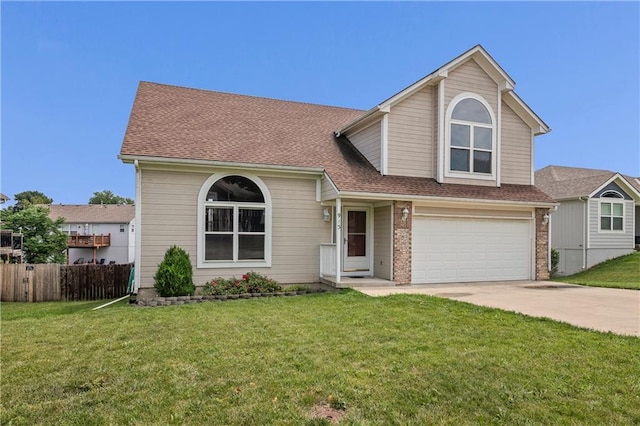 913 N Cochise Ave, Independence, MO 64056 - traditional-style house featuring a garage, driveway, and roof with shingles