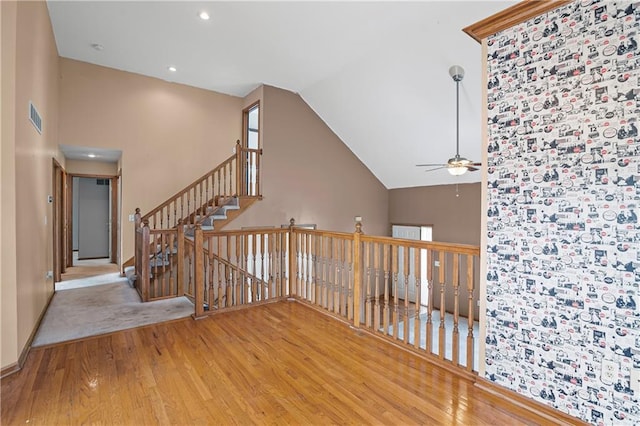 913 N Cochise Ave, Independence, MO 64056 - staircase featuring wood-type flooring, ceiling fan, vaulted ceiling, and recessed lighting