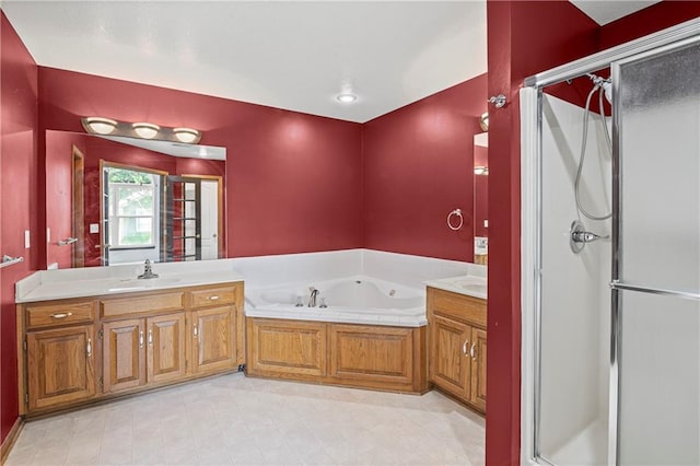913 N Cochise Ave, Independence, MO 64056 - bathroom with a stall shower, a bath, vanity, and tile patterned flooring
