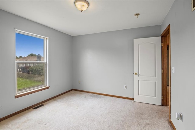 913 N Cochise Ave, Independence, MO 64056 - carpeted spare room featuring a pendent fire sprinkler and baseboards