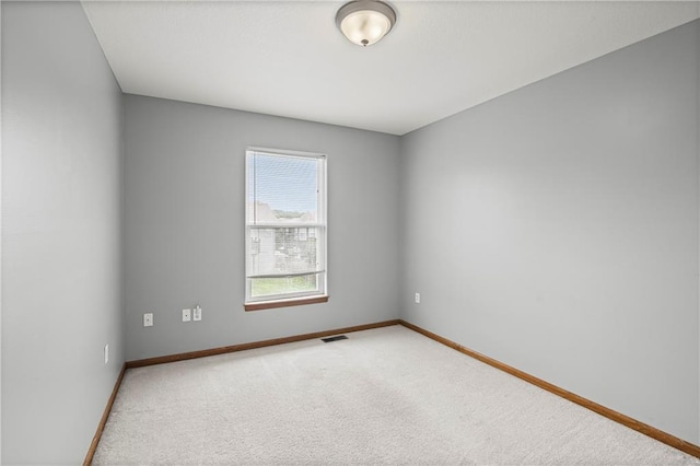 913 N Cochise Ave, Independence, MO 64056 - carpeted empty room with baseboards