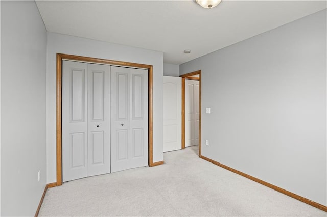 913 N Cochise Ave, Independence, MO 64056 - unfurnished bedroom featuring light carpet and a closet