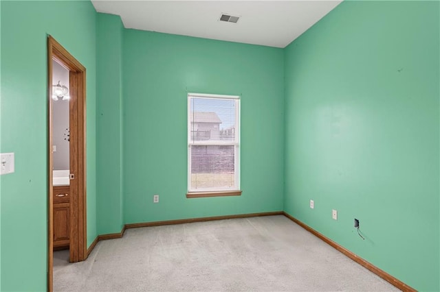 913 N Cochise Ave, Independence, MO 64056 - unfurnished bedroom with light colored carpet and baseboards