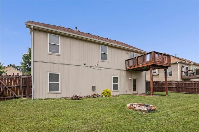 913 N Cochise Ave, Independence, MO 64056 - rear view of house with a fenced backyard, a wooden deck, and a fire pit
