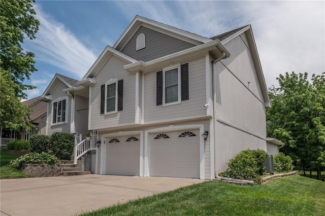 207 Woodhaven Dr, Smithville, MO 64089 - view of front of house with an attached garage, concrete driveway, and a front yard