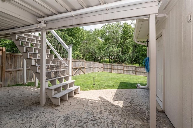 207 Woodhaven Dr, Smithville, MO 64089 - fenced backyard featuring stairway and a patio area
