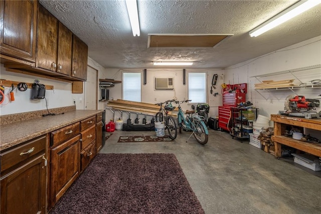 207 Woodhaven Dr, Smithville, MO 64089 - garage with a workshop area and a wall mounted AC