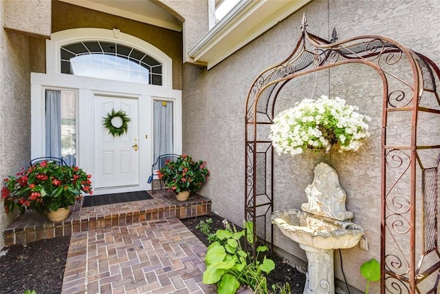 14333 Norwood St, Leawood, KS 66224 - view of exterior entry featuring stucco siding