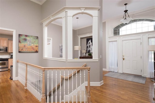 14333 Norwood St, Leawood, KS 66224 - foyer entrance with crown molding and light wood-style floors