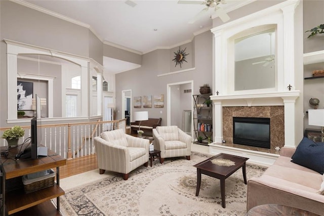 14333 Norwood St, Leawood, KS 66224 - living room featuring ceiling fan, crown molding, and a fireplace