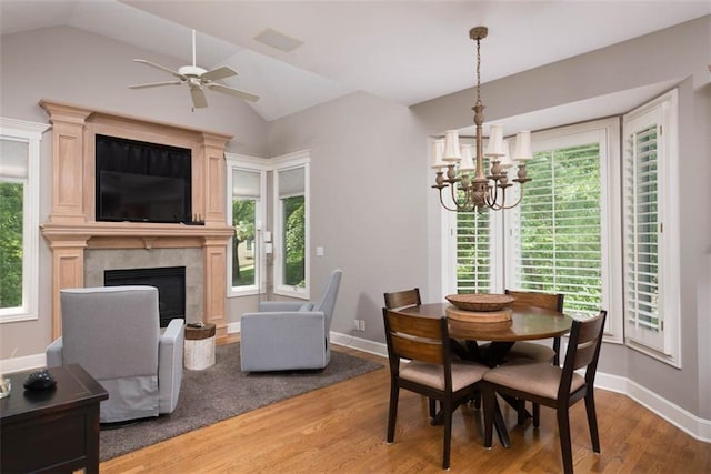 14333 Norwood St, Leawood, KS 66224 - dining area with lofted ceiling, a chandelier, light wood finished floors, and healthy amount of natural light
