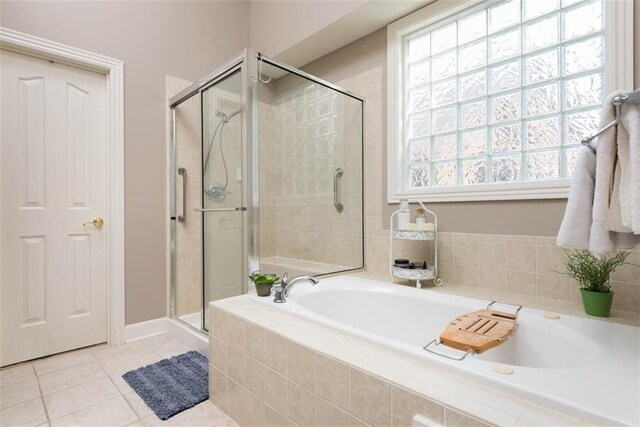 14333 Norwood St, Leawood, KS 66224 - bathroom featuring a bath, a shower stall, and tile patterned floors