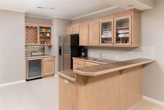 14333 Norwood St, Leawood, KS 66224 - kitchen featuring beverage cooler, a breakfast bar area, tasteful backsplash, and crown molding