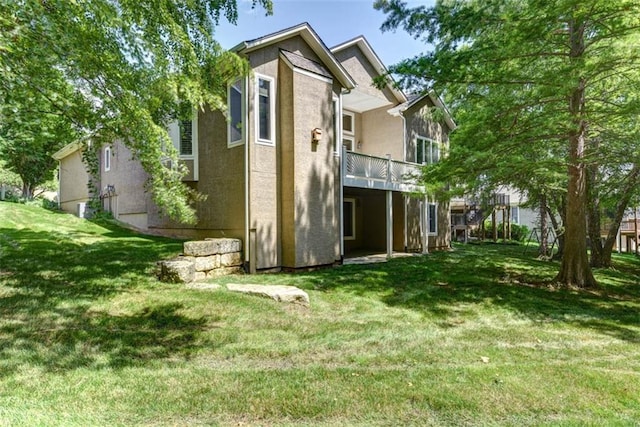 14333 Norwood St, Leawood, KS 66224 - back of house with a yard and stucco siding