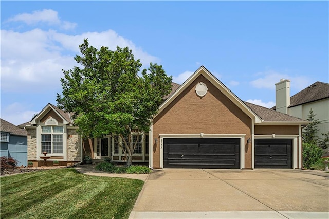 5713 NE Sapphire Ct, Lees Summit, MO 64064 - view of front of property with a garage, driveway, a front yard, and stucco siding