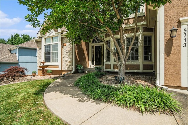 5713 NE Sapphire Ct, Lees Summit, MO 64064 - doorway to property featuring stone siding
