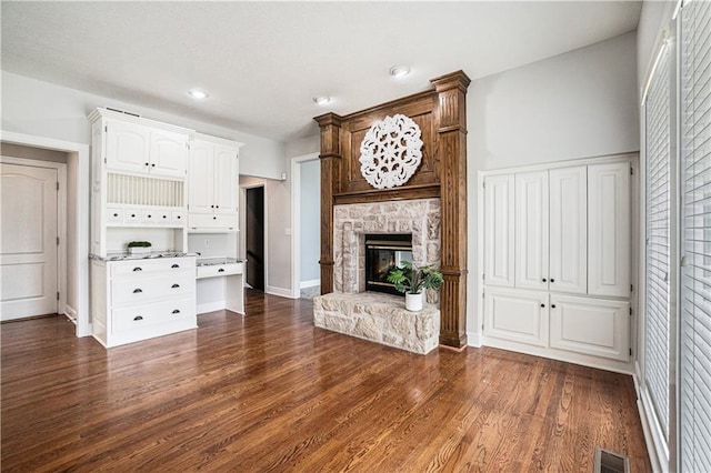 5713 NE Sapphire Ct, Lees Summit, MO 64064 - unfurnished living room with dark wood-style flooring, a fireplace, and recessed lighting