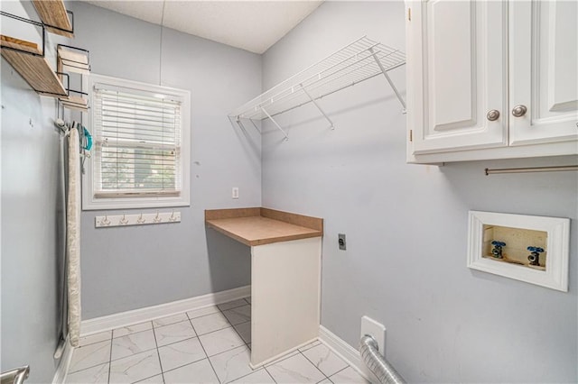5713 NE Sapphire Ct, Lees Summit, MO 64064 - washroom with electric dryer hookup, cabinet space, washer hookup, and light marble finish flooring