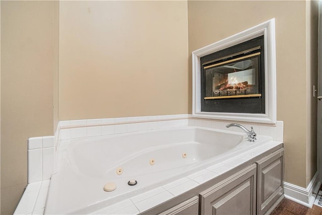 5713 NE Sapphire Ct, Lees Summit, MO 64064 - full bathroom featuring a tub with jets and baseboards