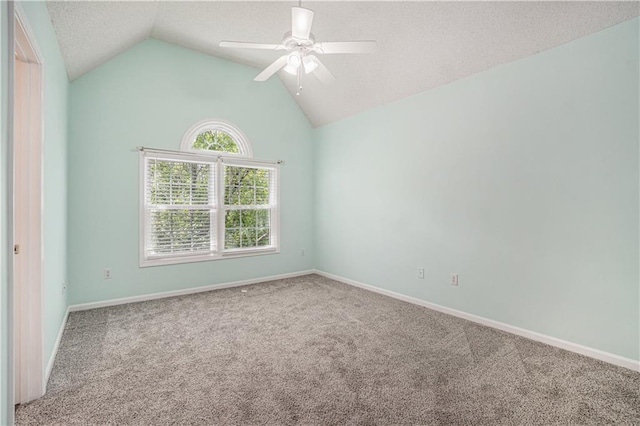 5713 NE Sapphire Ct, Lees Summit, MO 64064 - carpeted empty room with ceiling fan, lofted ceiling, and a textured ceiling