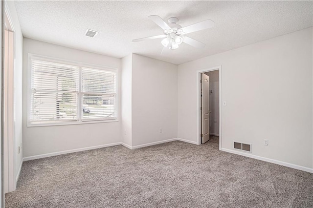 5713 NE Sapphire Ct, Lees Summit, MO 64064 - empty room featuring carpet flooring, a textured ceiling, and ceiling fan