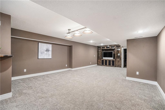 5713 NE Sapphire Ct, Lees Summit, MO 64064 - unfurnished living room featuring carpet flooring and a textured ceiling