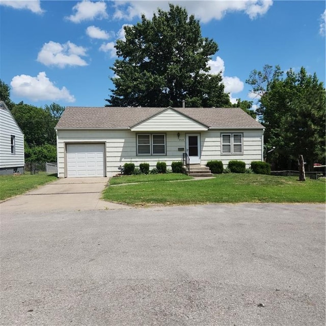 9529 Summit St, Lenexa, KS 66215 - view of front facade featuring an attached garage, driveway, and roof with shingles