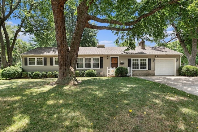 8201 W 89th St, Overland Park, KS 66212 - ranch-style home with an attached garage, a chimney, a front lawn, and concrete driveway