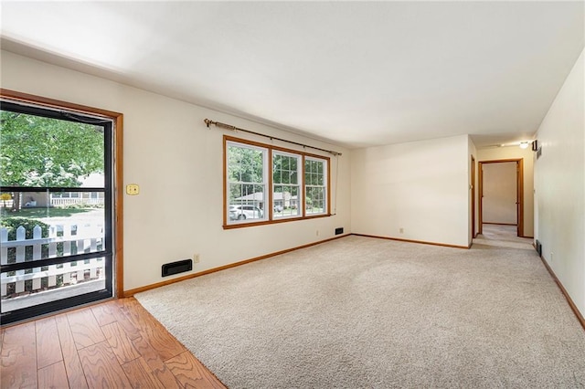 8201 W 89th St, Overland Park, KS 66212 - unfurnished room with healthy amount of natural light and light wood-style flooring