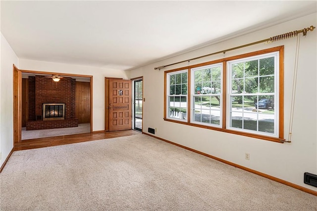 8201 W 89th St, Overland Park, KS 66212 - unfurnished living room featuring carpet and a brick fireplace