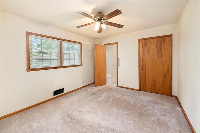 8201 W 89th St, Overland Park, KS 66212 - unfurnished bedroom with carpet flooring, ensuite bath, ceiling fan, and a closet