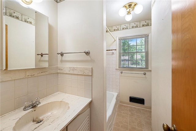 8201 W 89th St, Overland Park, KS 66212 - full bath featuring vanity, tile patterned flooring, bathtub / shower combination, and decorative backsplash