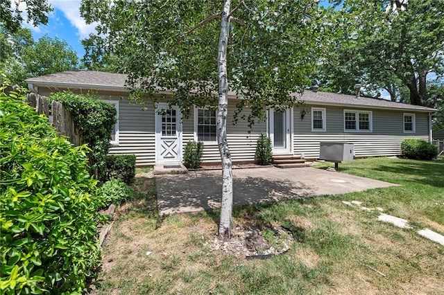 8201 W 89th St, Overland Park, KS 66212 - view of front of property with entry steps, a front lawn, and a patio