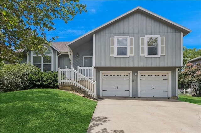 17150 S Walter St, Gardner, KS 66030 - split level home featuring a garage, concrete driveway, and a front lawn