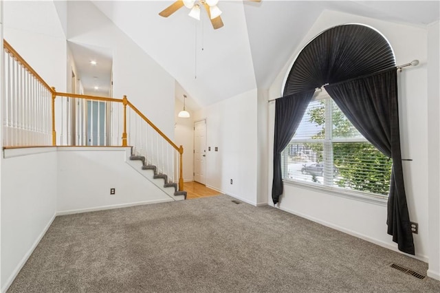 17150 S Walter St, Gardner, KS 66030 - unfurnished living room featuring carpet floors, vaulted ceiling, ceiling fan, and stairs