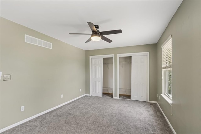 17150 S Walter St, Gardner, KS 66030 - unfurnished bedroom featuring two closets, carpet, and a ceiling fan
