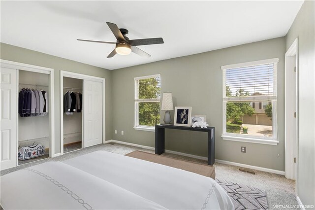 17150 S Walter St, Gardner, KS 66030 - bedroom featuring two closets, light colored carpet, and a ceiling fan