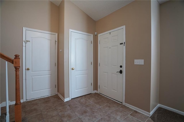 17586 W 161st St, Olathe, KS 66062 - entrance foyer with dark tile patterned floors and stairway