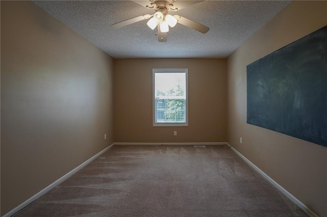 17586 W 161st St, Olathe, KS 66062 - empty room featuring a textured ceiling, carpet, and a ceiling fan
