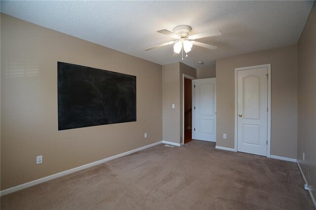 17586 W 161st St, Olathe, KS 66062 - unfurnished bedroom with carpet flooring, a textured ceiling, and a ceiling fan