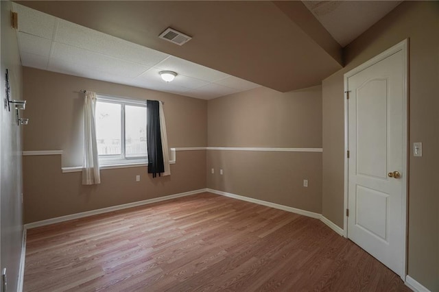 17586 W 161st St, Olathe, KS 66062 - empty room with wood finished floors and a drop ceiling