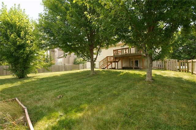 17586 W 161st St, Olathe, KS 66062 - fenced backyard with stairway and a deck