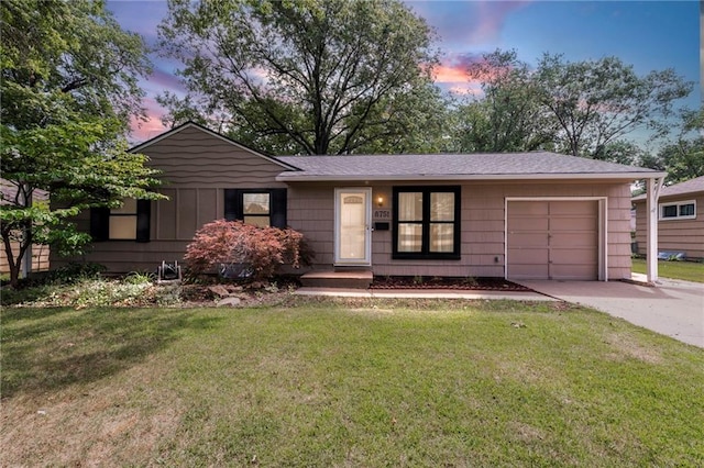 8751 Goddard St, Overland Park, KS 66214 - single story home featuring an attached garage, driveway, a front lawn, and a shingled roof