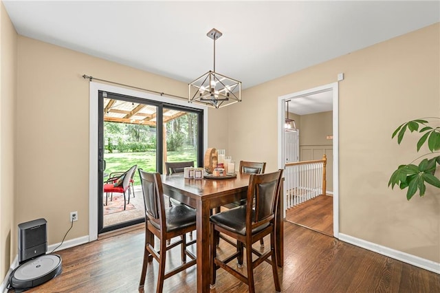 8751 Goddard St, Overland Park, KS 66214 - dining space with a chandelier and dark wood-style floors