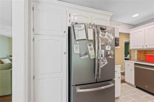 8751 Goddard St, Overland Park, KS 66214 - kitchen with appliances with stainless steel finishes, white cabinets, light countertops, and recessed lighting
