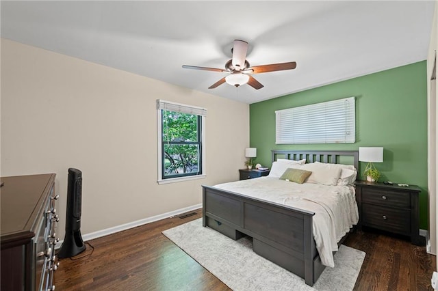 8751 Goddard St, Overland Park, KS 66214 - bedroom with dark wood-type flooring and ceiling fan