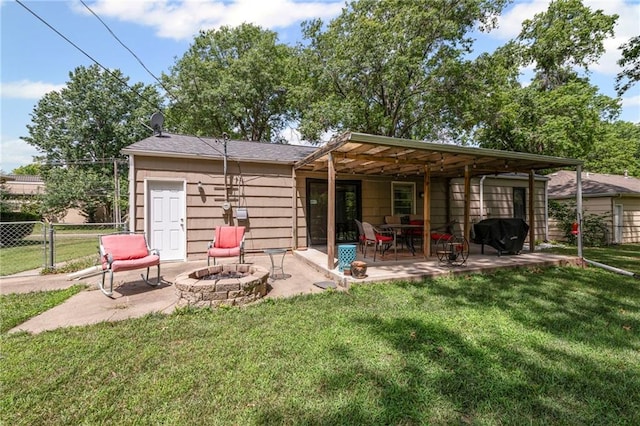 8751 Goddard St, Overland Park, KS 66214 - back of property featuring an outdoor fire pit and a patio area