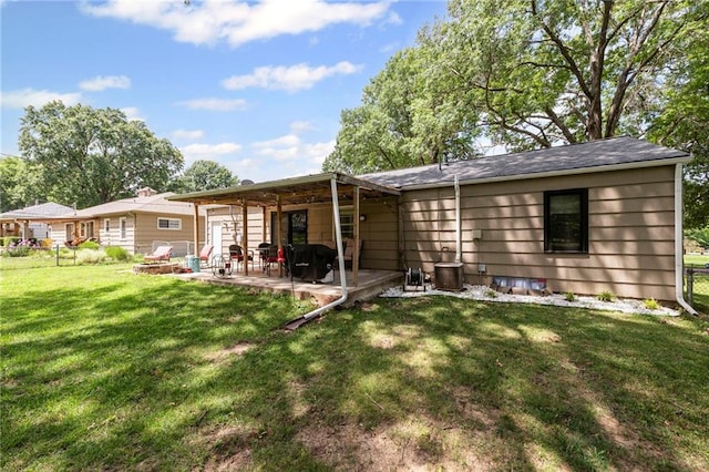 8751 Goddard St, Overland Park, KS 66214 - rear view of house featuring a patio and a yard