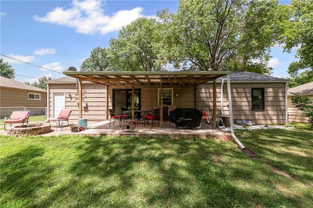 8751 Goddard St, Overland Park, KS 66214 - rear view of house with a fire pit and a patio area